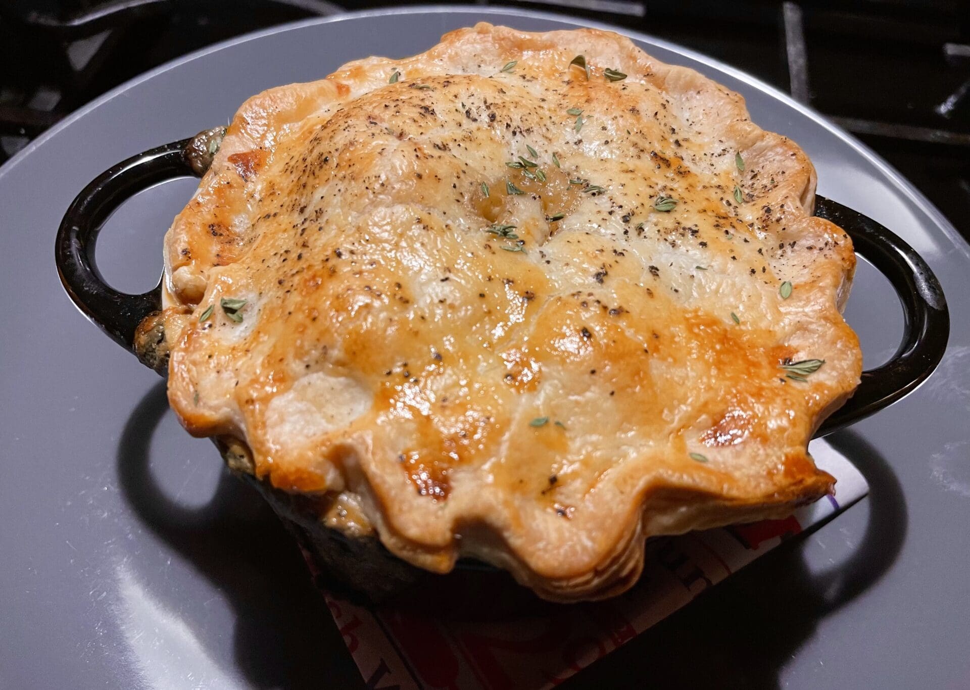 A pot pie sitting on top of a stove.