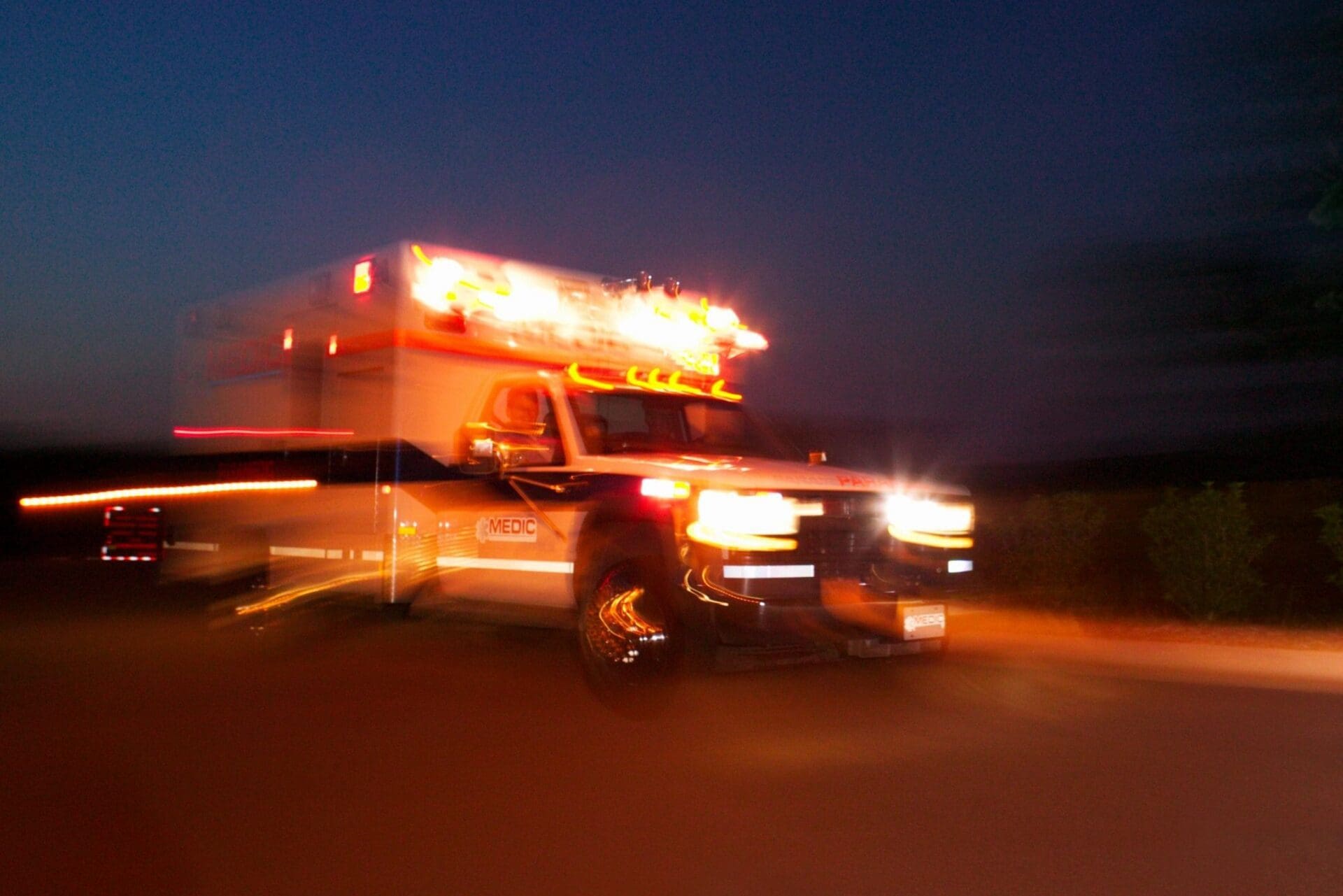 A blurry image of an ambulance truck.