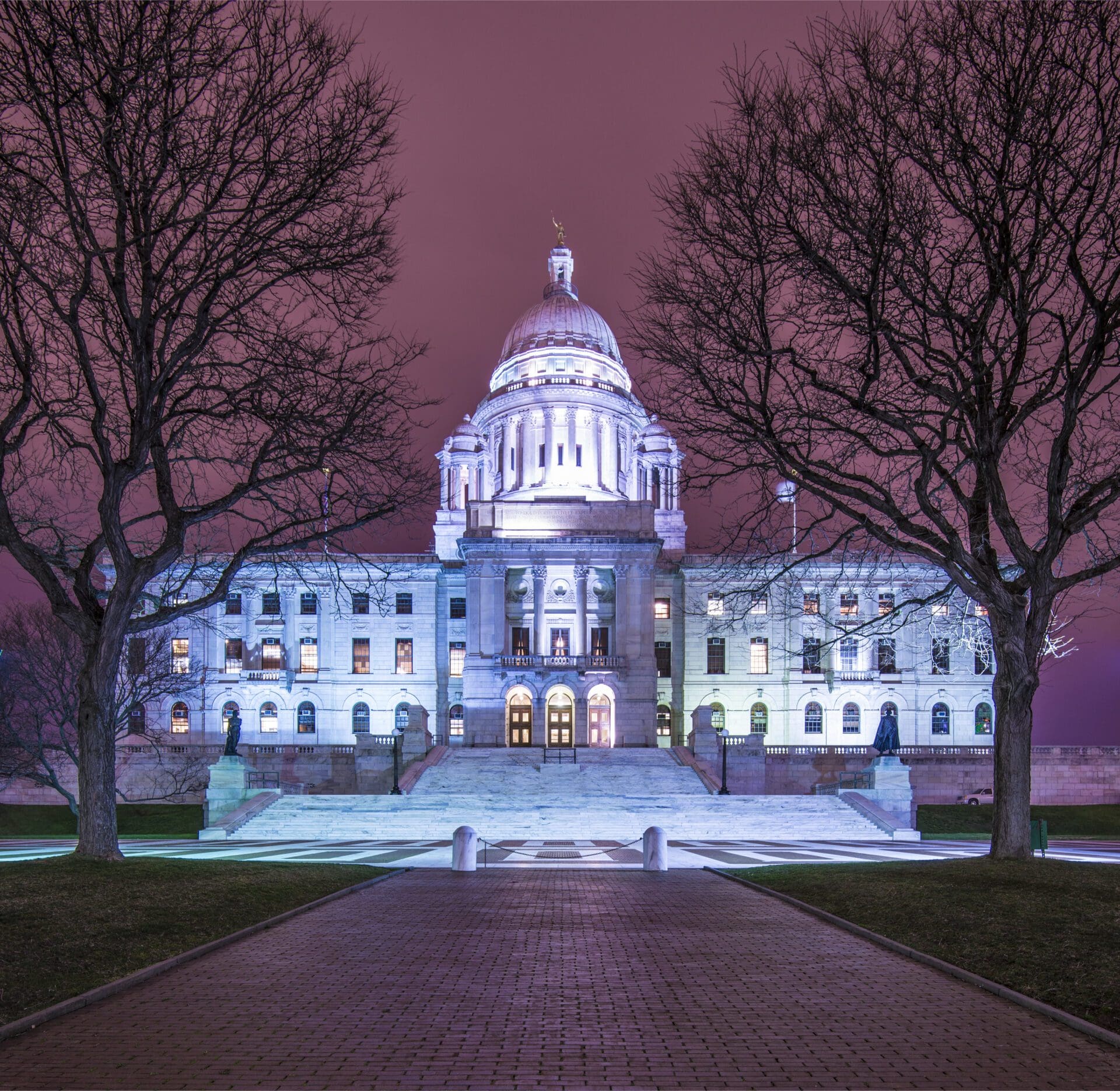 The state capitol building is lit up at night.