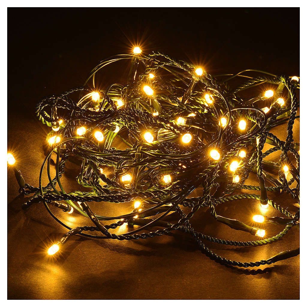 A bunch of string lights on a dark surface.