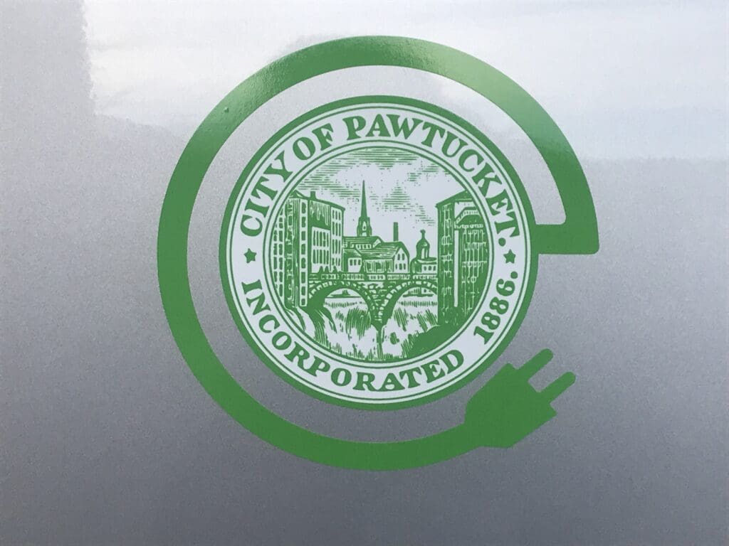 The city of pawtucket logo is shown on the side of a vehicle.