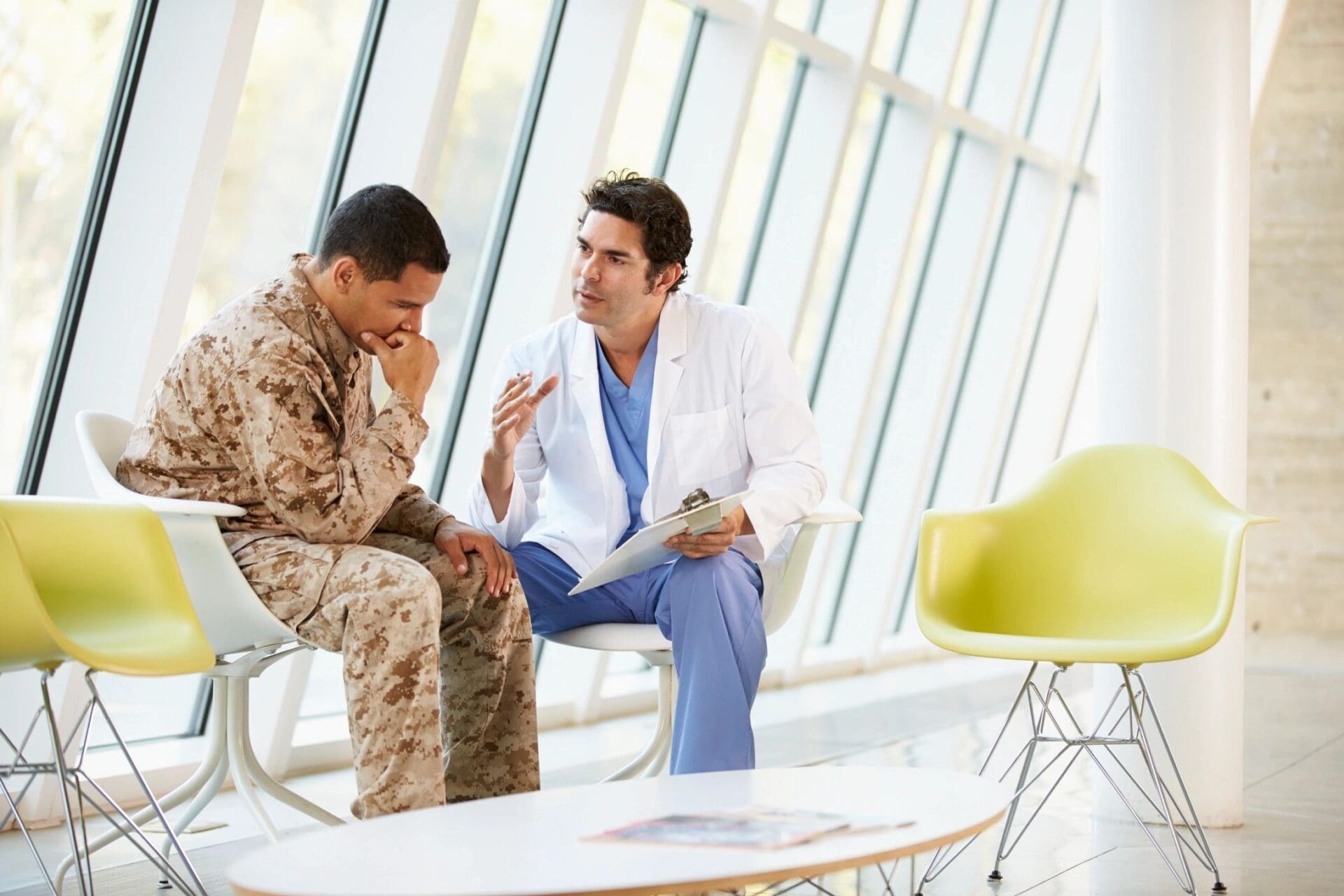 Two doctors talking in a waiting room.