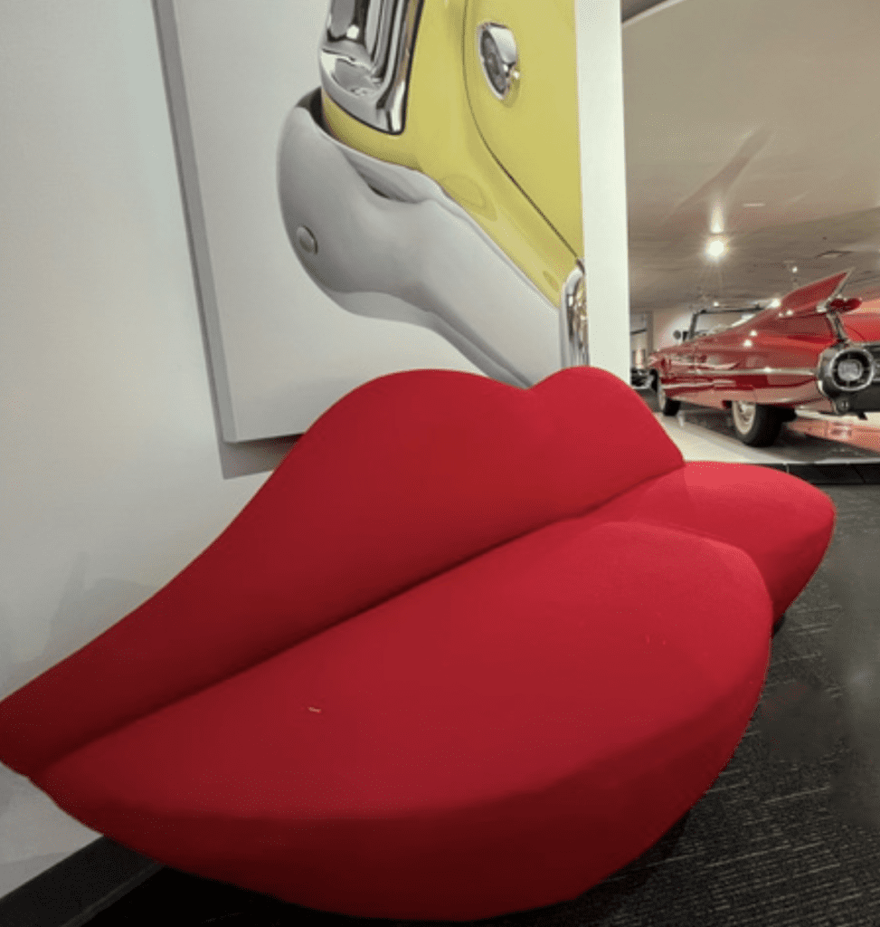 A red couch in a showroom.