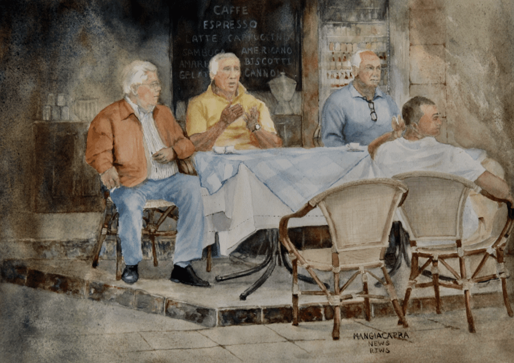A group of men sitting at a table.