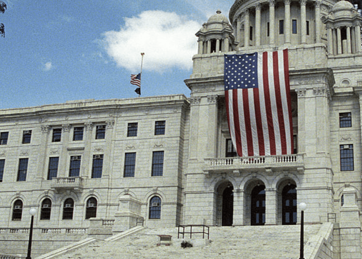 A large building with a flag on top of it.