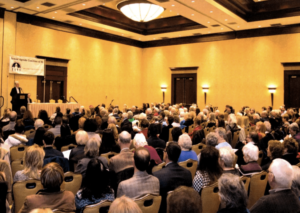 A large group of people in a room.