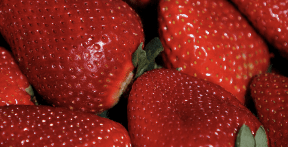 A close up of a bunch of red strawberries.