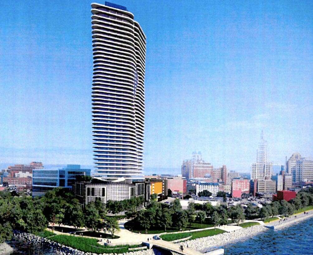 An artist's rendering of a tall building near the water.