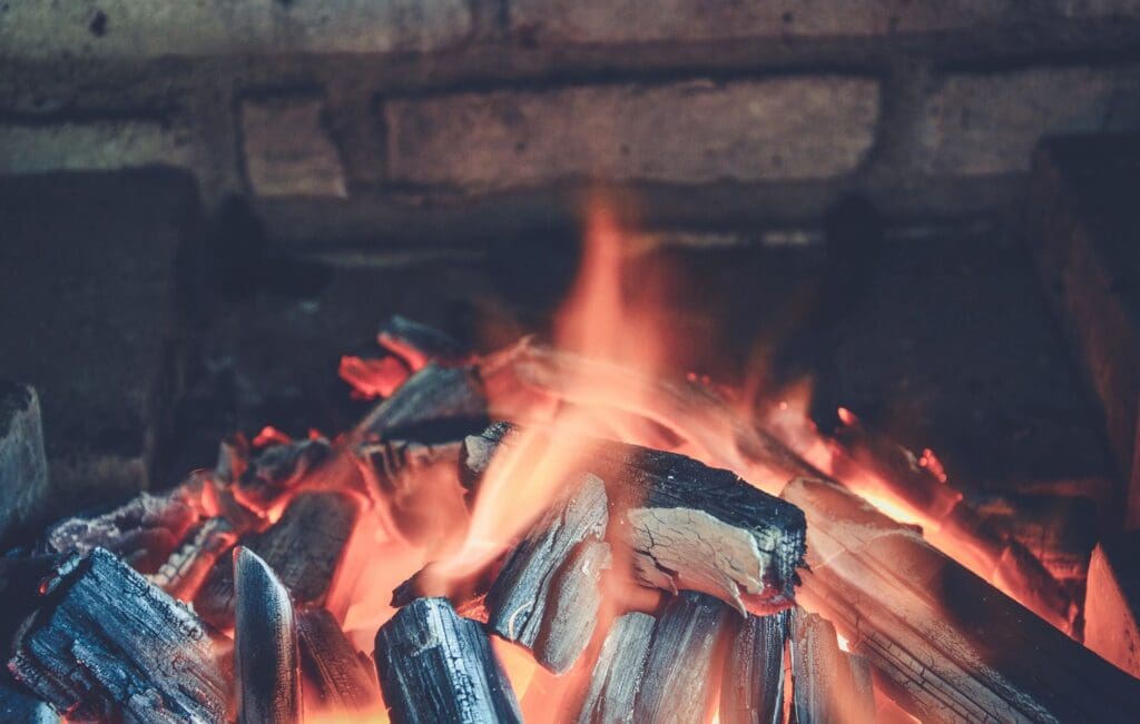A close up image of a fire in a fireplace.