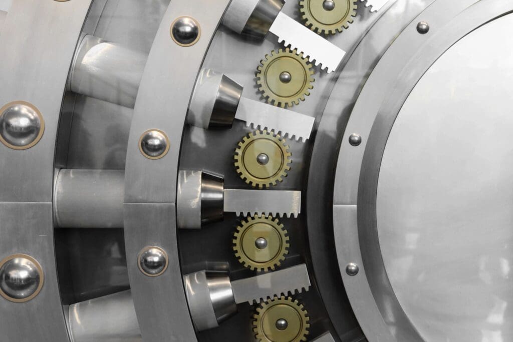A close up of a bank vault with gears and gears.