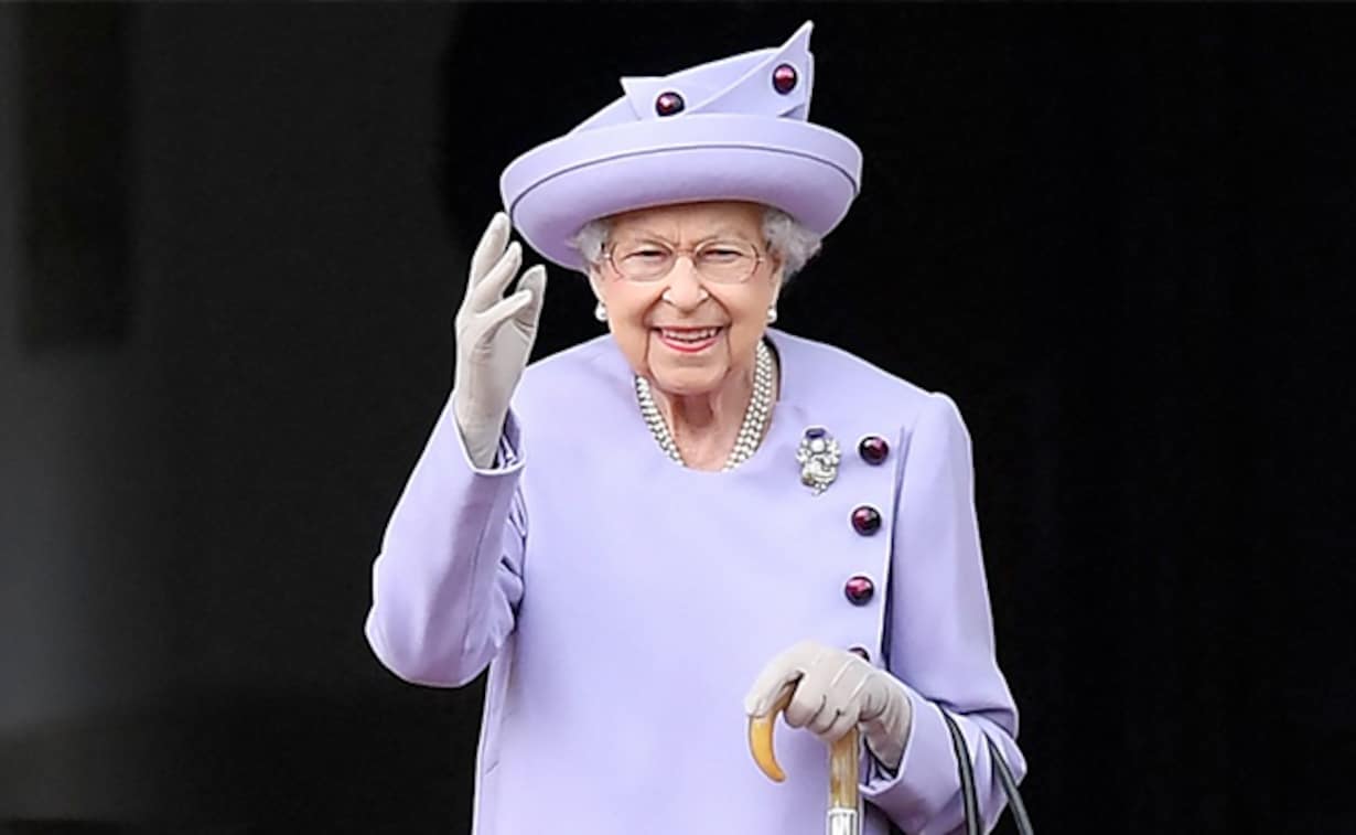 Queen elizabeth iii in a purple coat and hat.