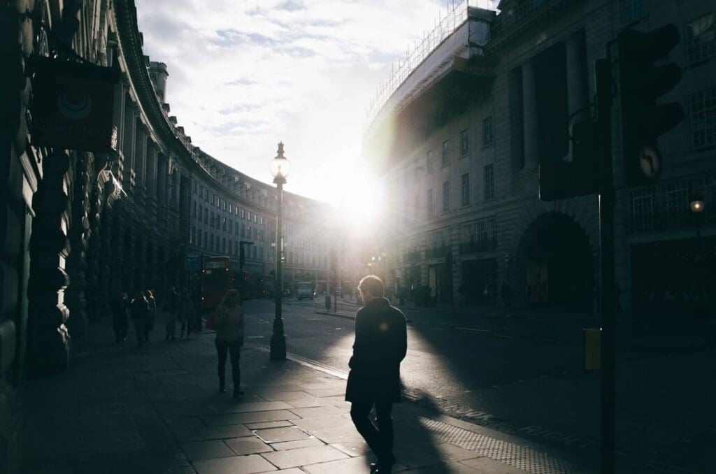 A person walking down a street in london.