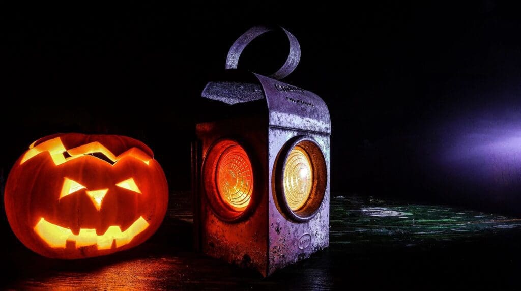 A jack o lantern and a carved jack o lantern.