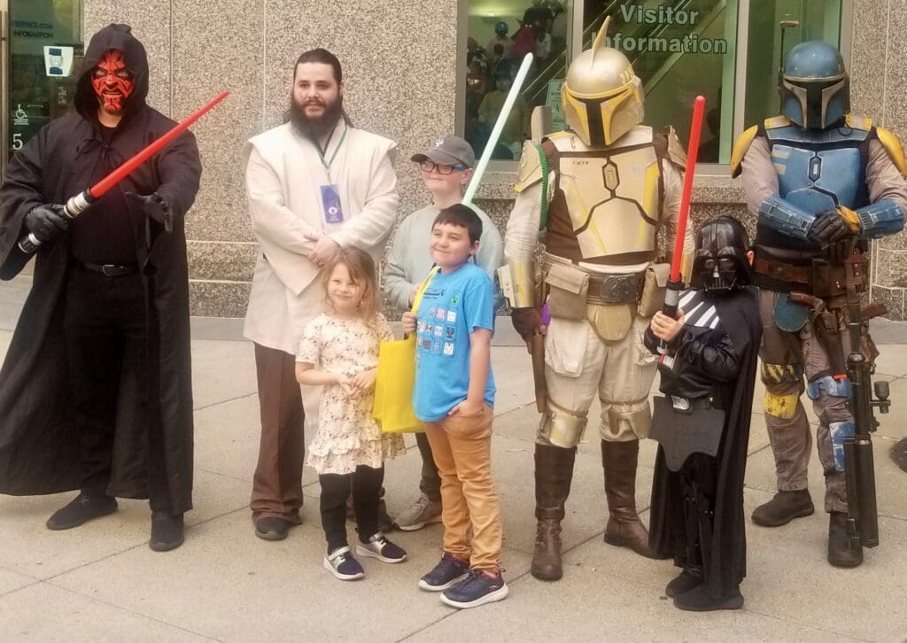 A group of people dressed up as star wars characters.