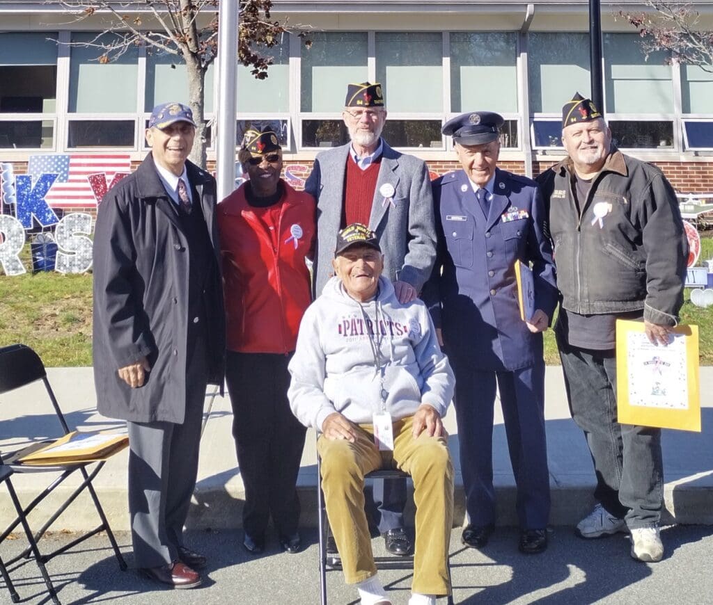 A group of veterans posing for a photo.