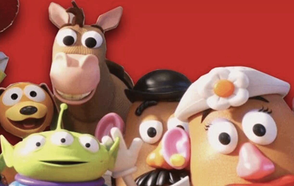 A group of toy story characters in front of a red background.