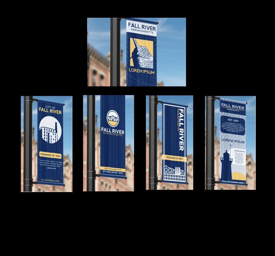 Four banners on a pole in front of a building.