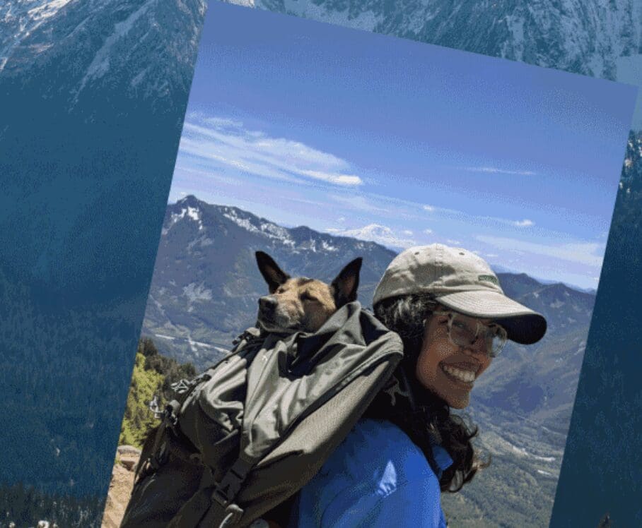 A woman wearing a backpack with a dog on it.