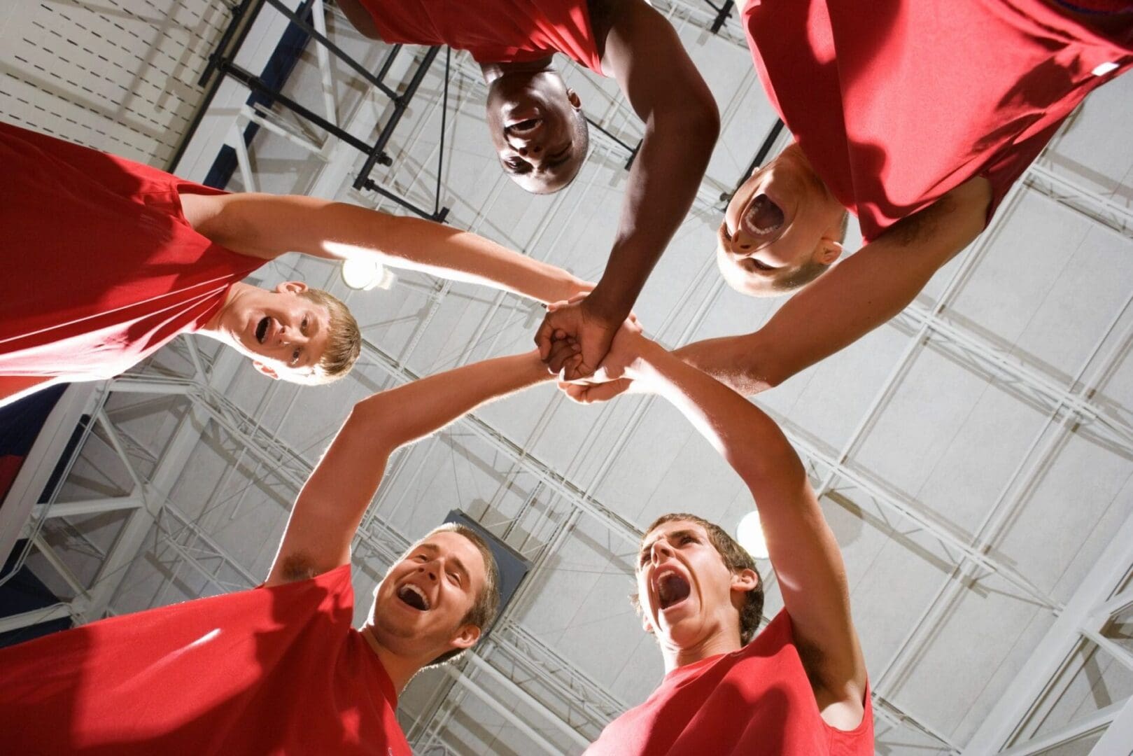 A group of basketball players making a huddle.