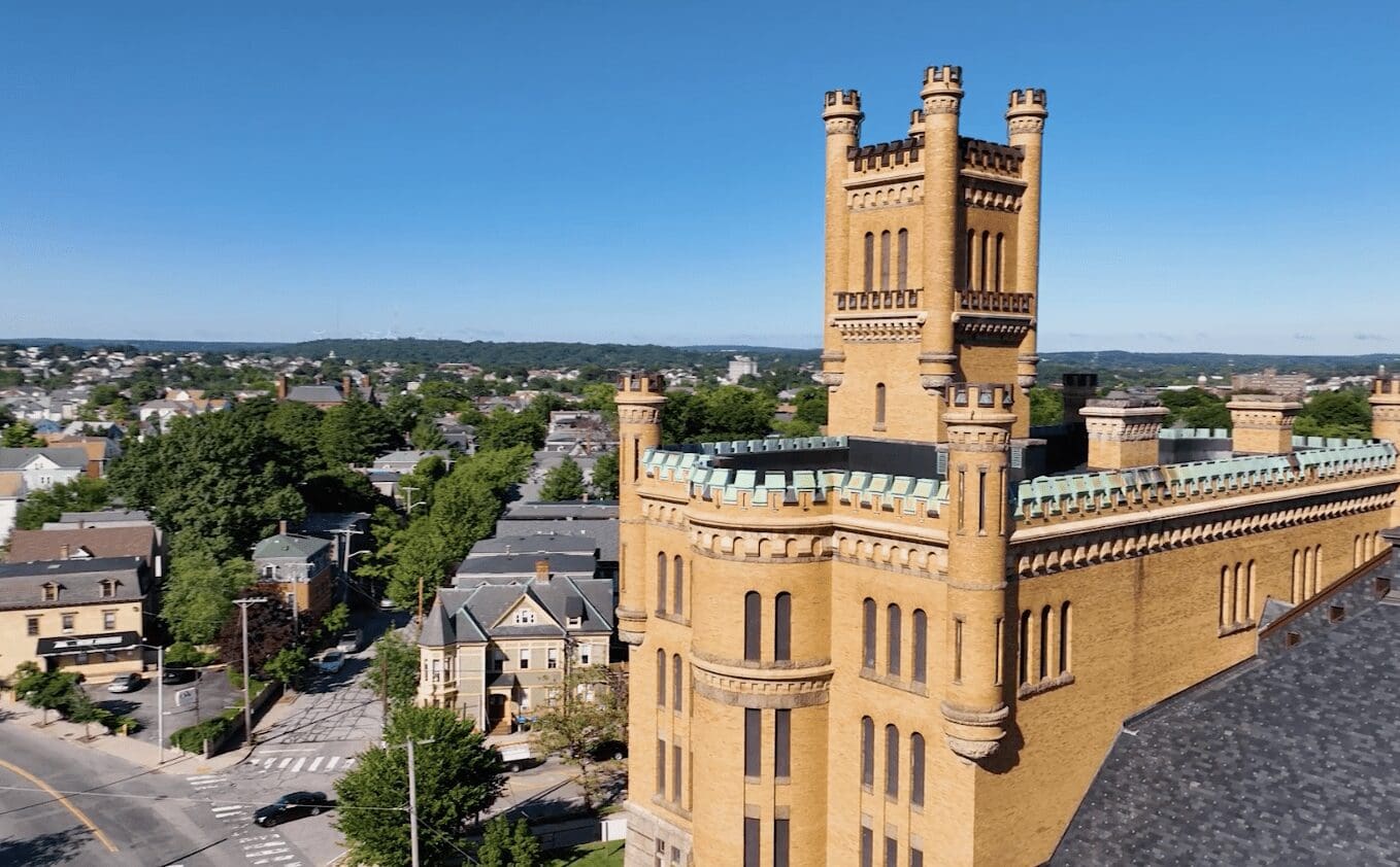 An aerial view of an old building with a clock tower.