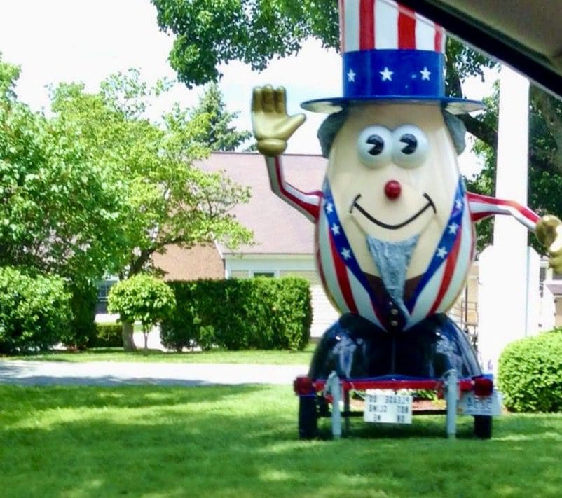 A statue of an american flag with an egg on it, showcased at the Bristol 4th of July Parade.