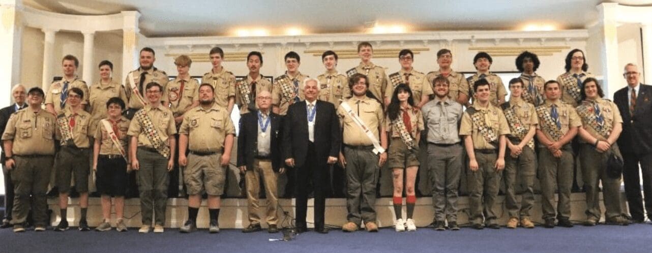 A group of Boy Scouts of America posing for a picture.