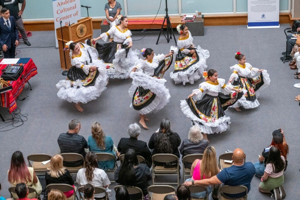 A group of Mexican dancers showcase their exceptional skills in front of an enthusiastic arts audience.