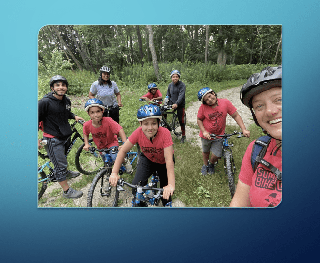 A biking group posing for a photo.