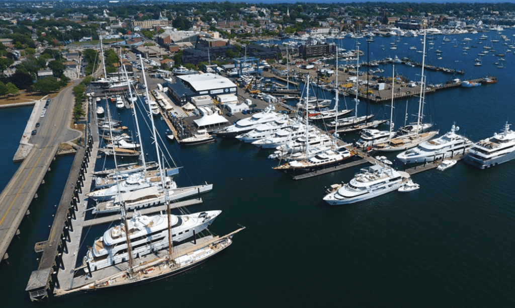 An aerial view of many yachts docked in the Newport Harbor.