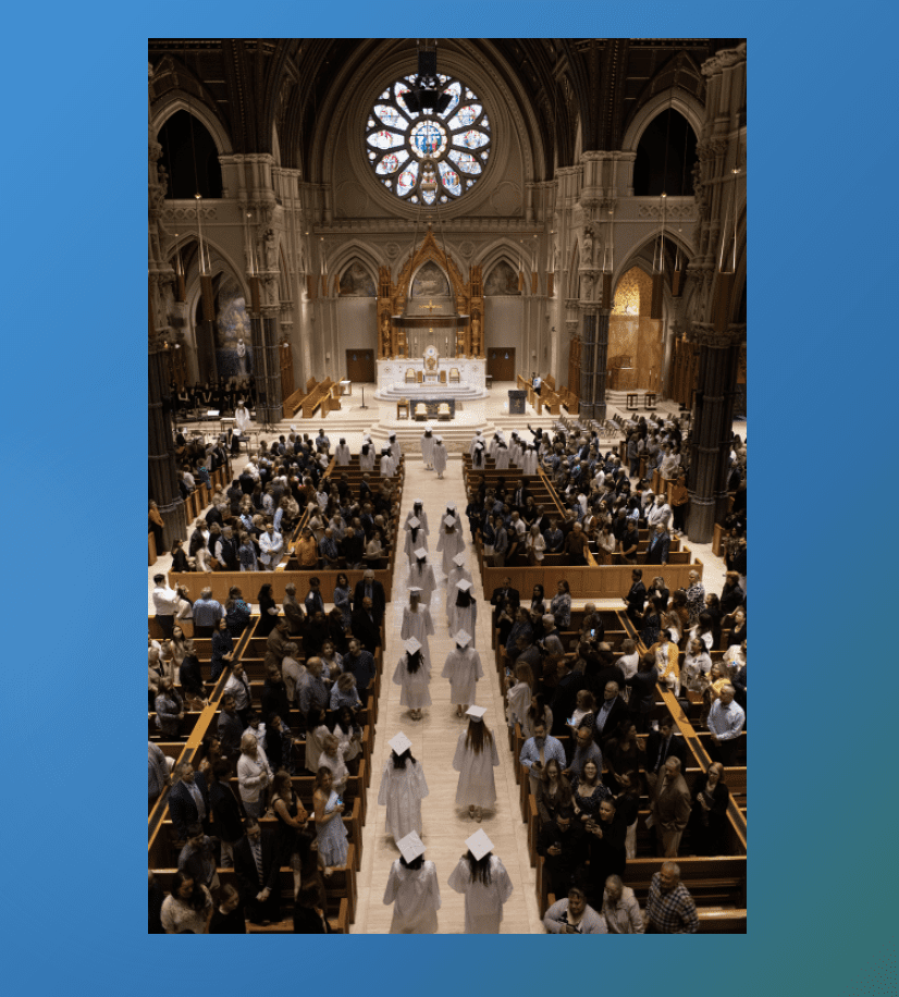 A blue and white photo of a church with people walking down the aisle.
