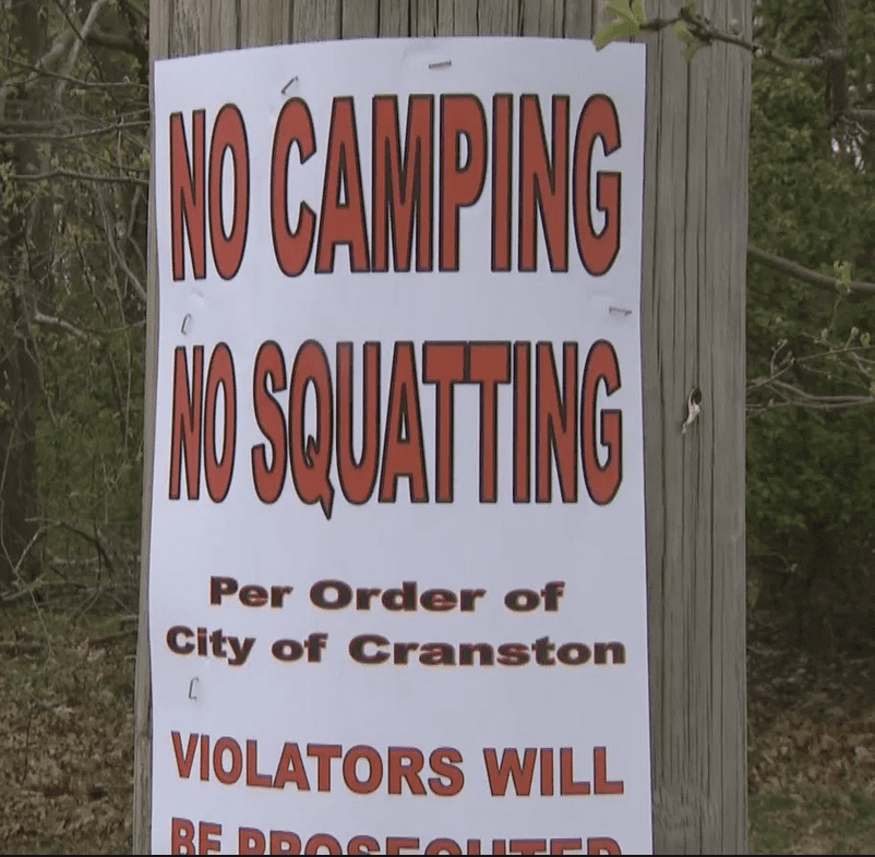 No camping or squatting allowed per order of City of Cranston, addressing the issue of homelessness.