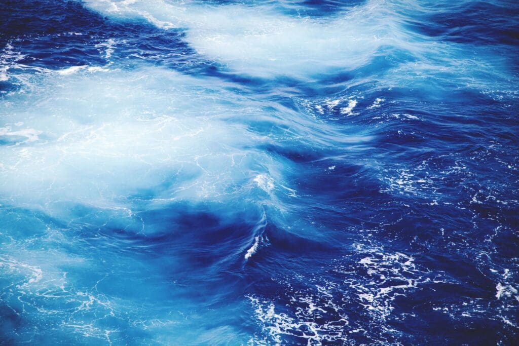 A close up image of blue water in the ocean.