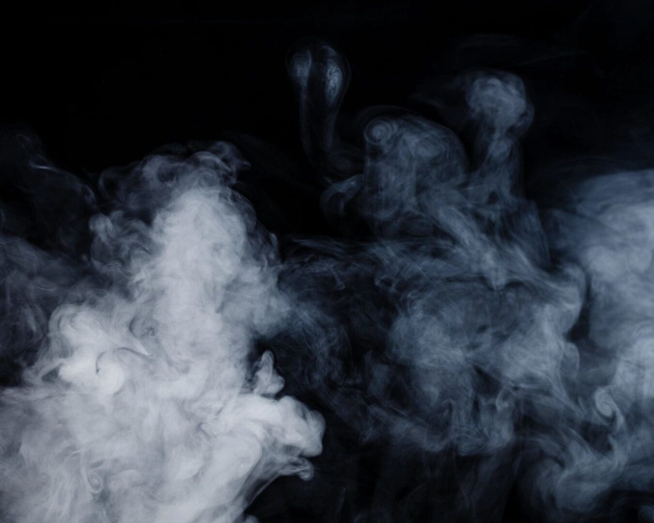 A close up of smoke on a black background.