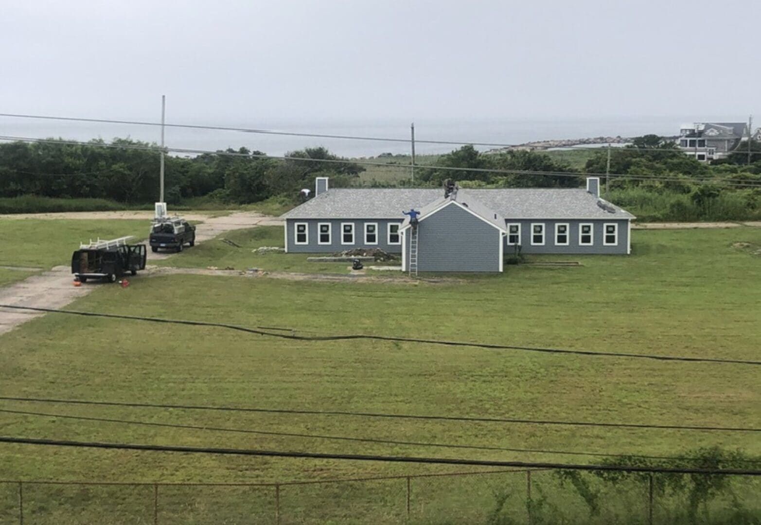 An aerial view of a house near the ocean.