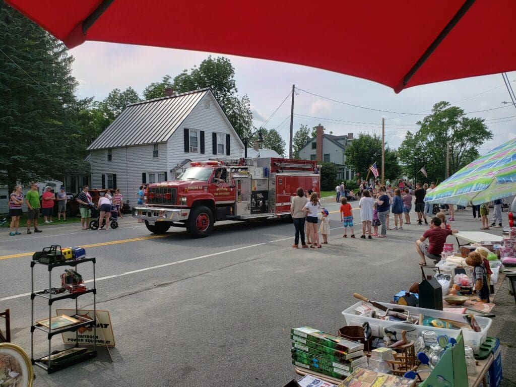 A fire truck driving down a street.