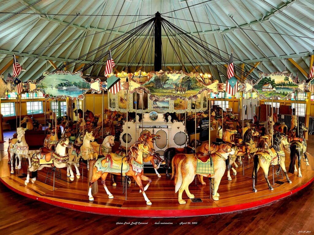 A carousel with many horses.