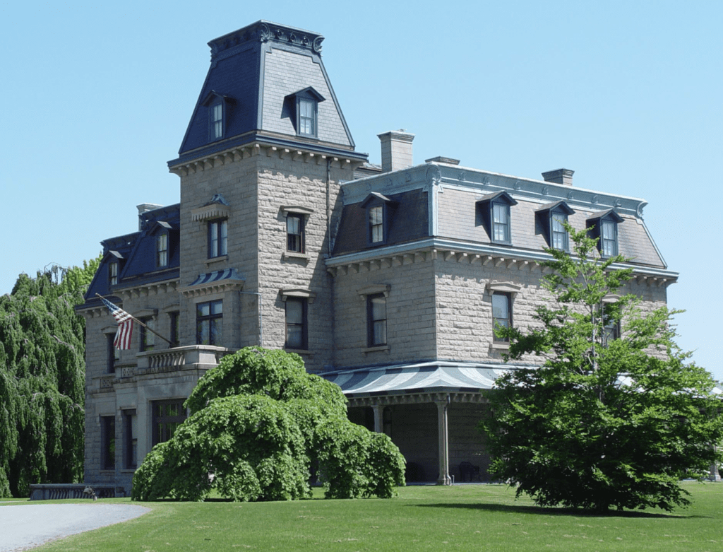 A grand Newport mansion, a sprawling stone building that is an epitome of architectural opulence.