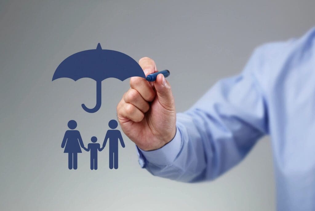 A man drawing a family with an umbrella.
