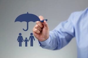 A man drawing a family with an umbrella.