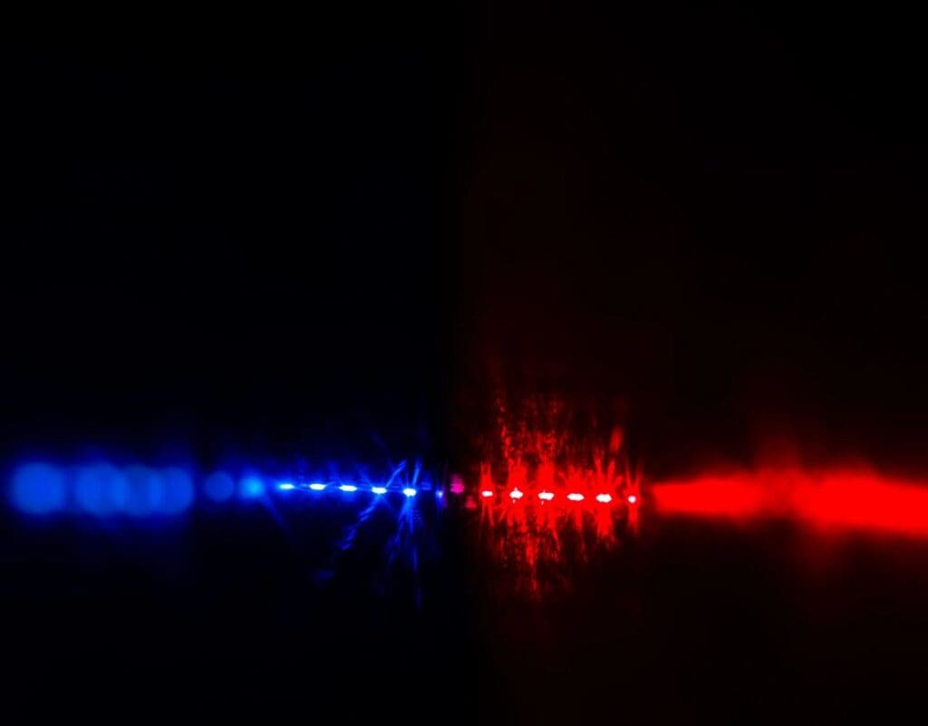 A blue and red light in the dark.