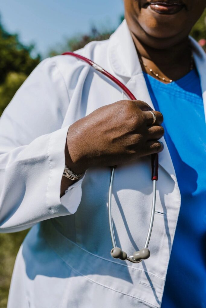 A woman in a white coat with a stethoscope.