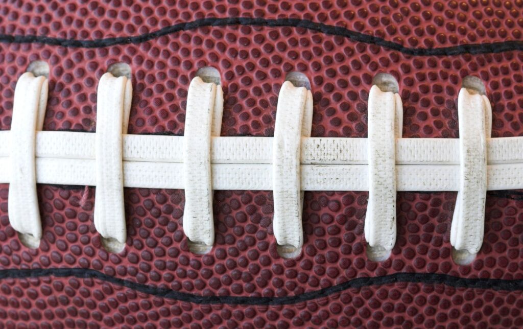 A close up photo of an american football.