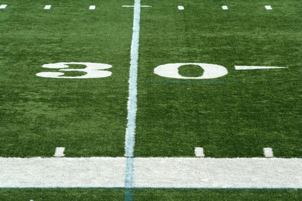 A football field with the number 30 on it.