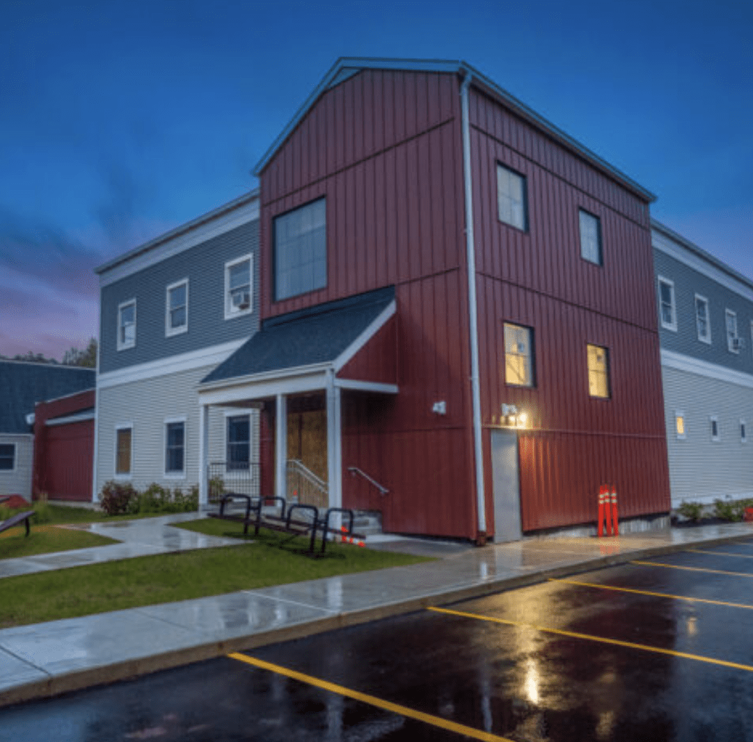 The exterior of the Wood River Health Services building at dusk.