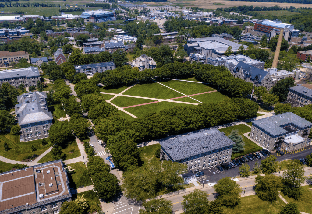 An aerial view of the Soloviev campus with green grass and trees.