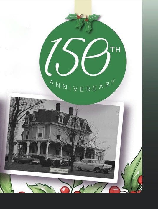 A photo of a house in Newport RI with the words 15th anniversary on it.