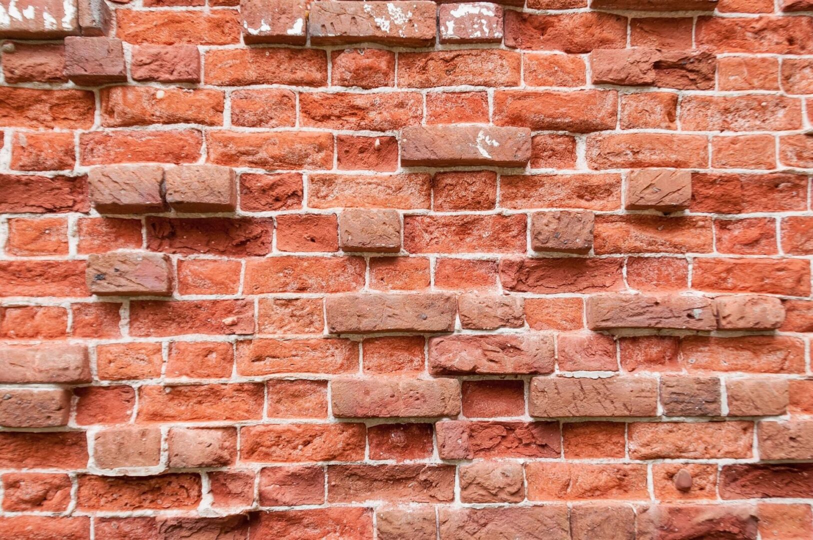 A close up of a red brick wall.