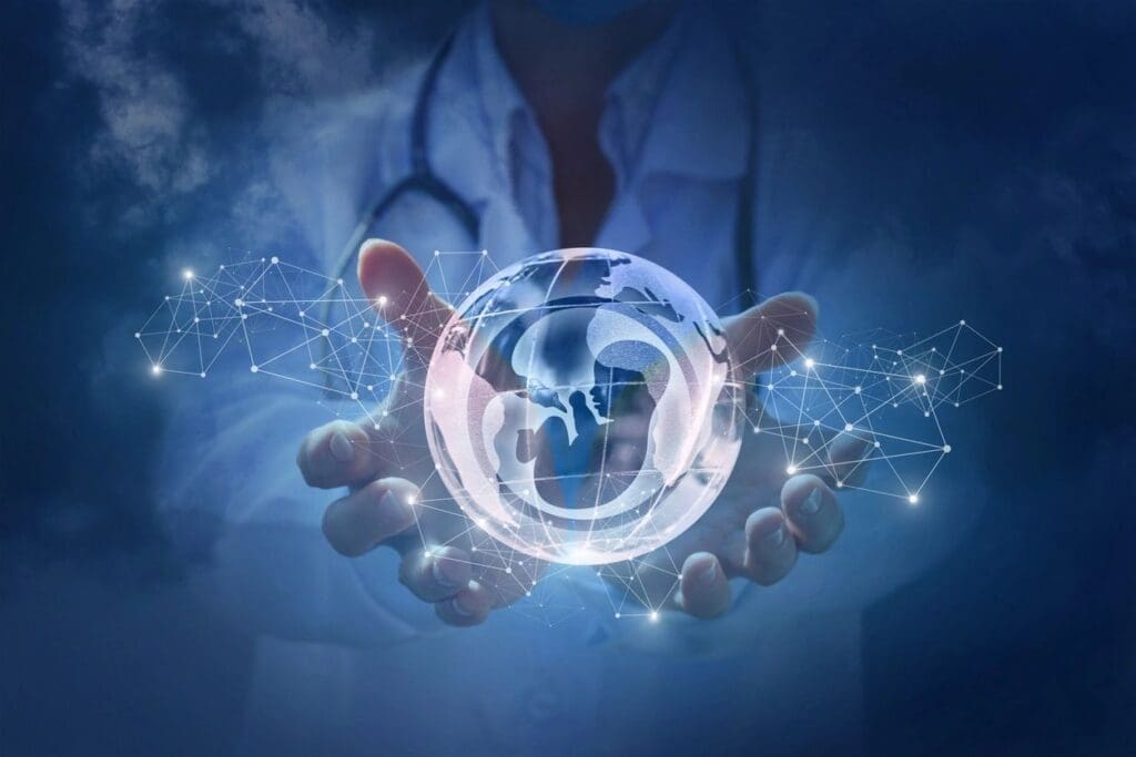 A doctor is holding a glass ball with a stethoscope in it.