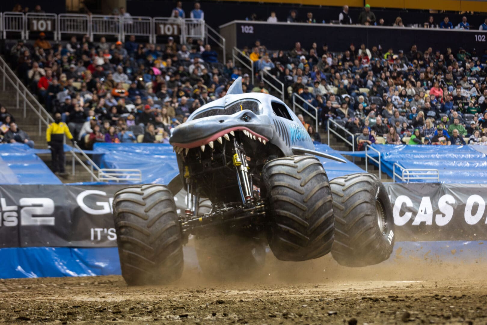A Monster Jam truck in the dirt.