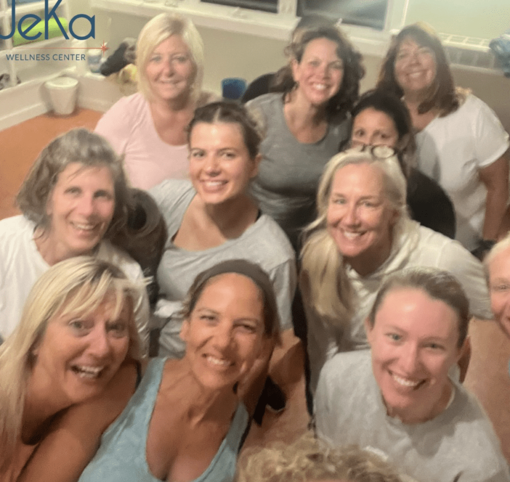 A group of women networking in a yoga studio.